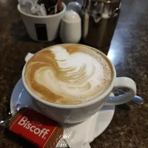Coffee and food on the counter at Chai Latte